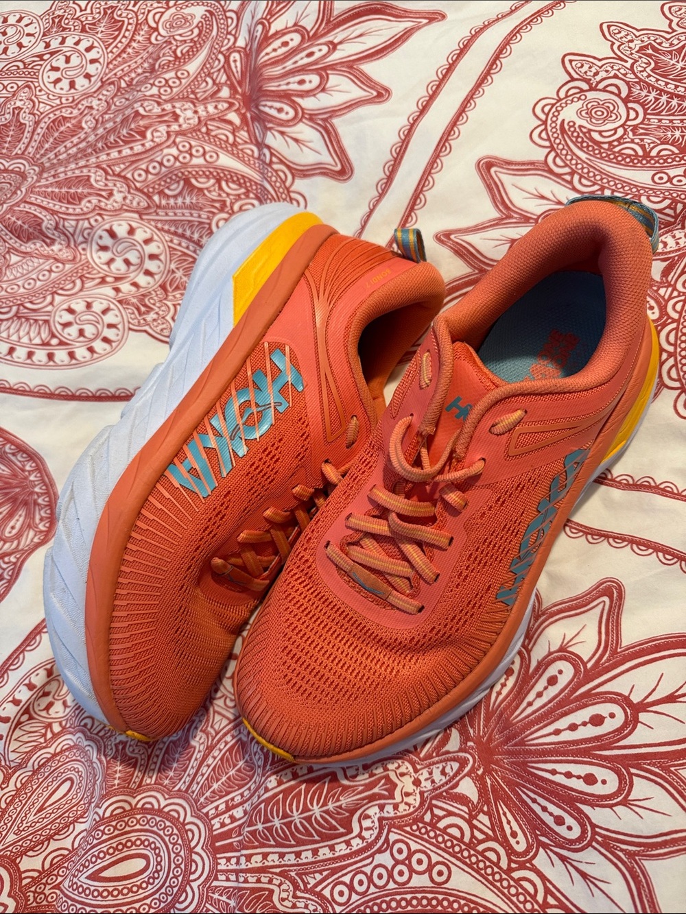 Hoka Women’s Coral-Orange Sneakers with Yellow Accents